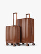 CALPAK Two-Piece Set in light Honey Brown which includes the Carry On and Large sizes with vertical ridges, shown on a clean white background; LAM2000-HONEY-BROWN