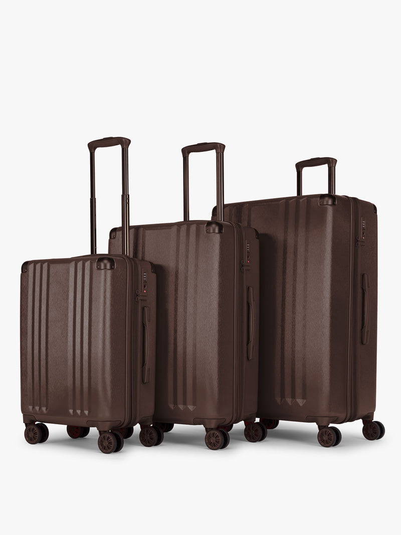 CALPAK Ambeur 3 piece luggage set in brown Walnut that includes a Carry-On Luggage, Medium Luggage, and large Luggage