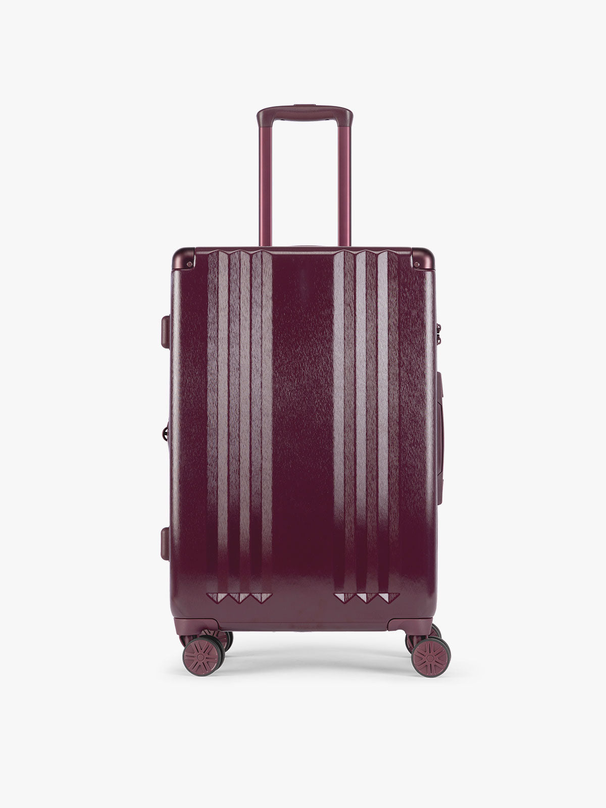 Carry On Size of CALPAK Three-Piece Set in dark burgundy Dark Cherry which includes the Carry On and Large sizes with vertical ridges, shown on a clean white background; LAM3000-DARK-CHERRY
