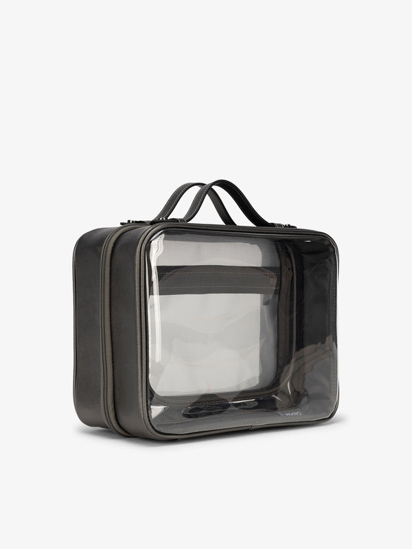 CALPAK large clear skincare bag with multiple zippered compartments in dark gray metallic steel