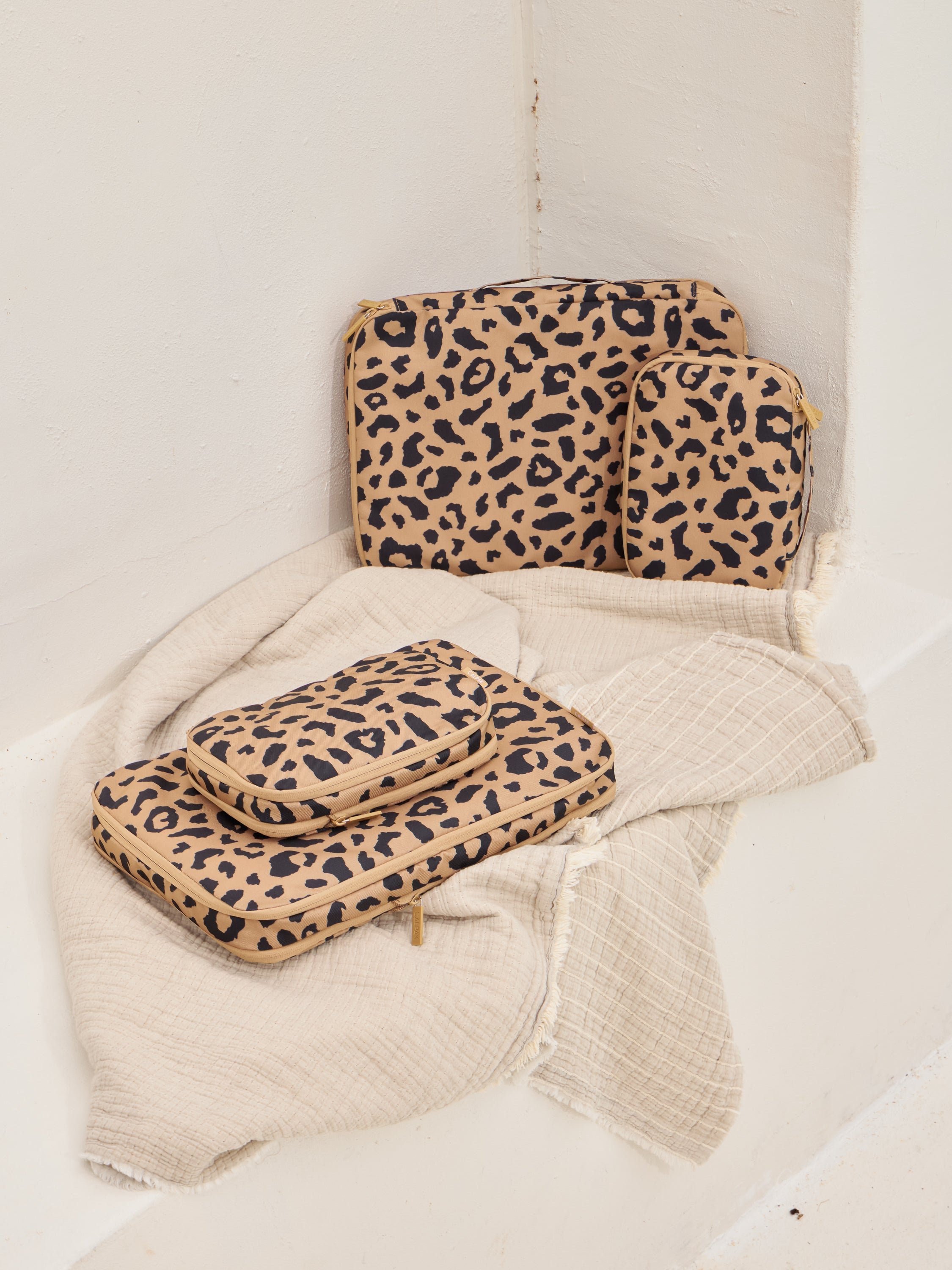 CALPAK large and small compression packing cubes with top handle in cheetah print