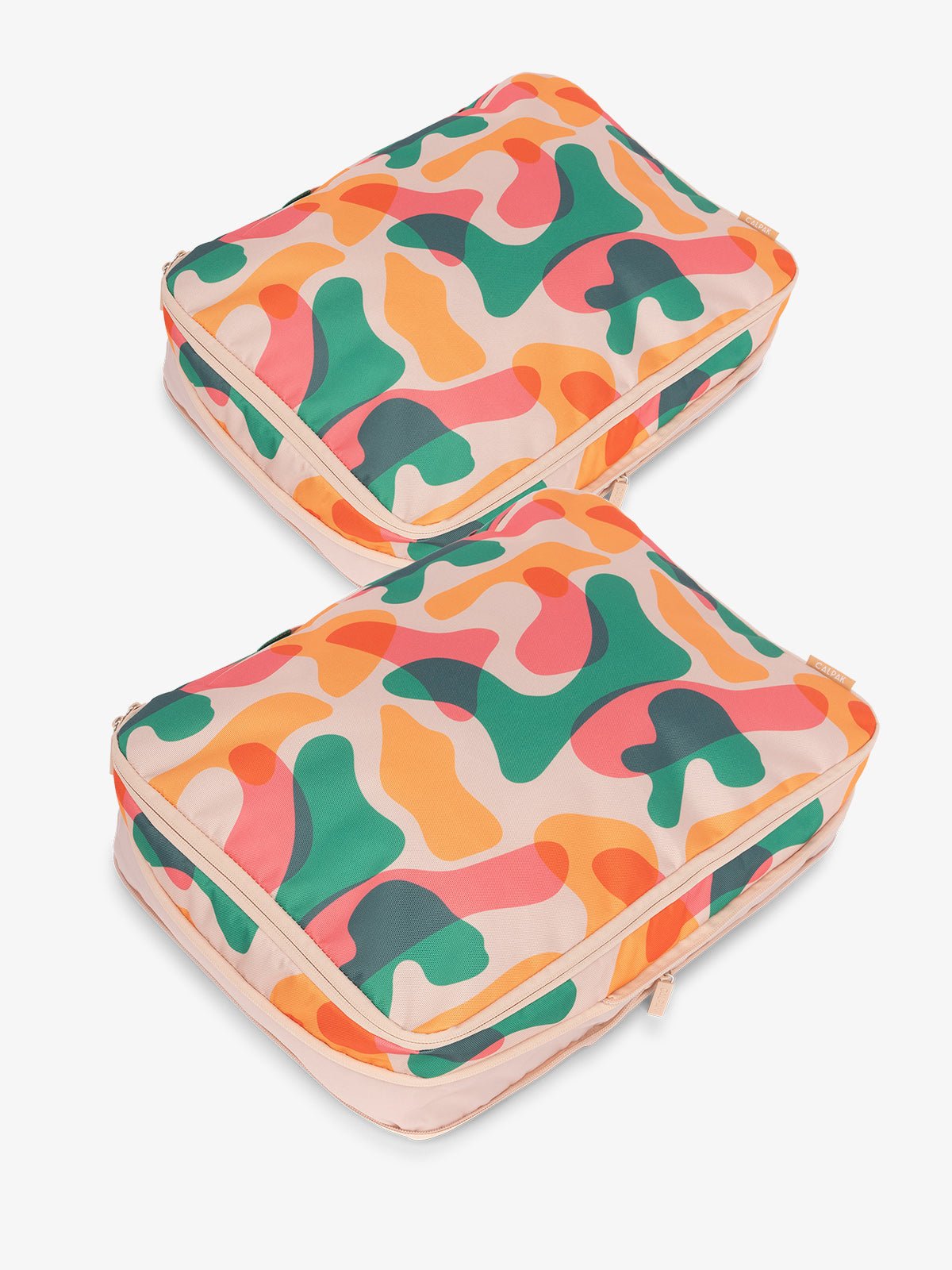 CALPAK large packing cubes with top handles and expandable by 4.5 inches in pink and green abstract print
