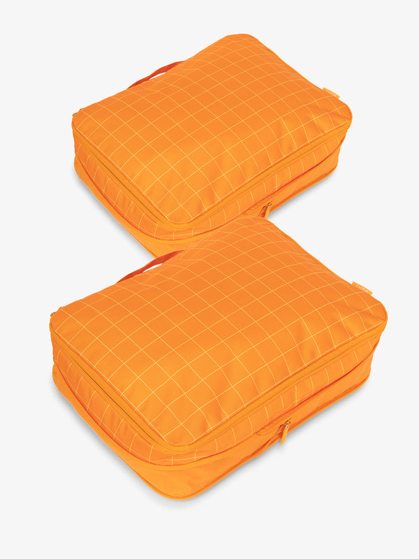 CALPAK large packing cubes with top handles and expandable by 4.5 inches in orange