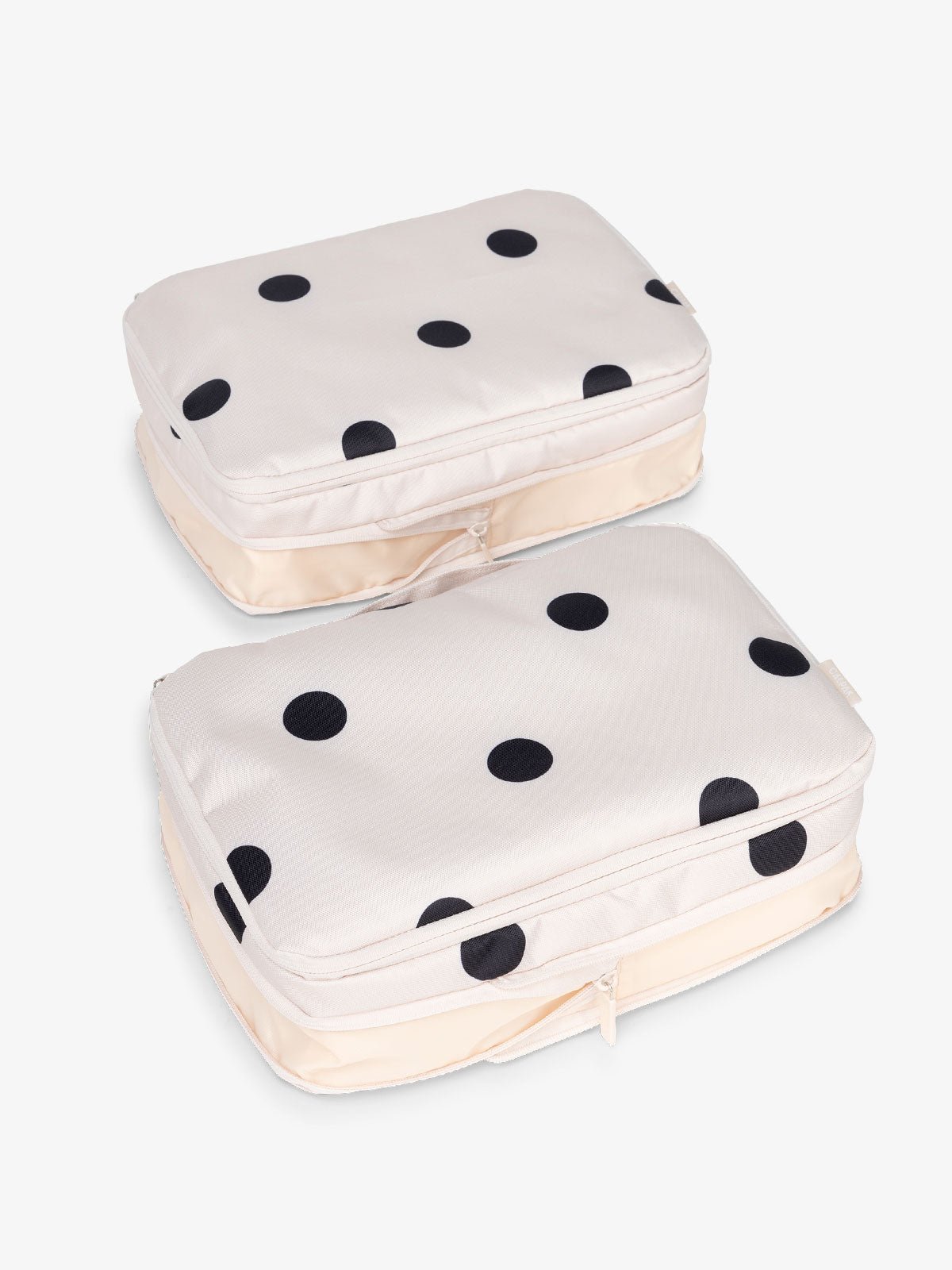 CALPAK large packing cubes with top handles and expandable by 4.5 inches in polka dot
