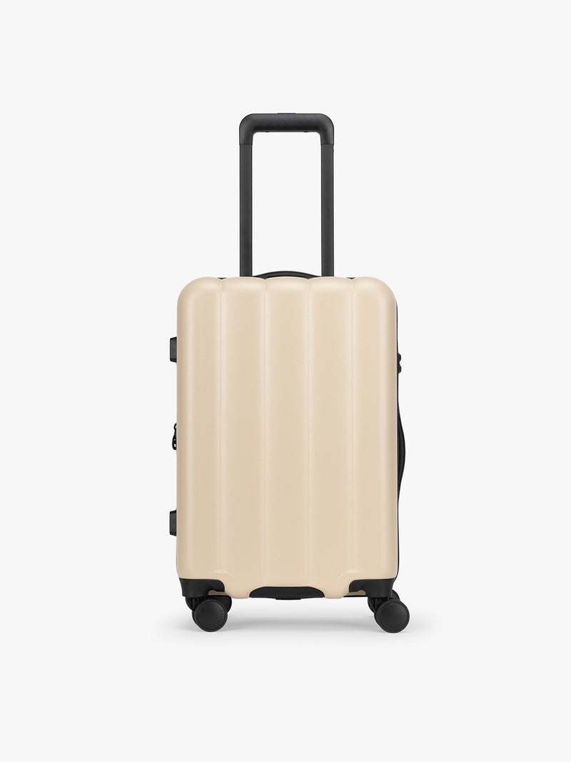 CALPAK Evry Carry-On Luggage in beige exterior and polka dot interior Polka Dot