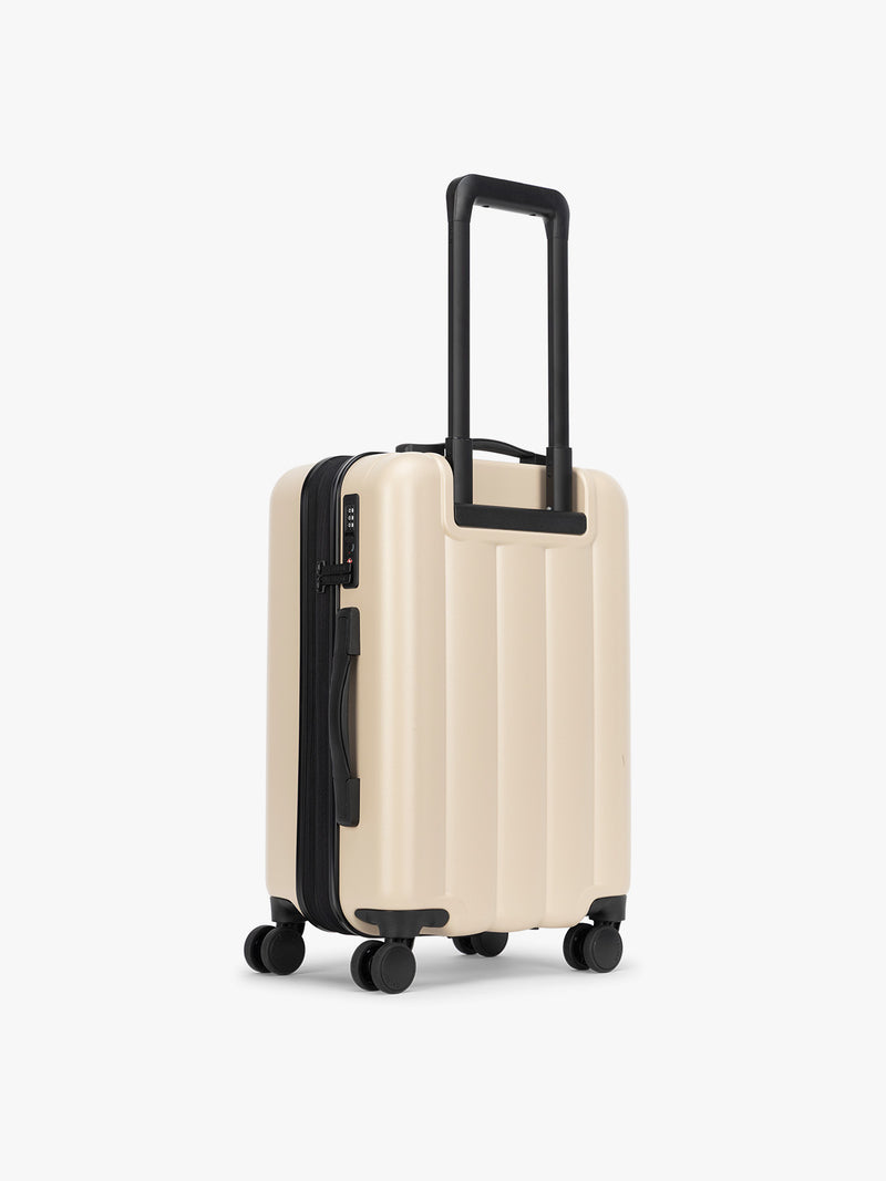 Backside of CALPAK Evry Carry-On Luggage in beige exterior and polka dot interior Polka Dot