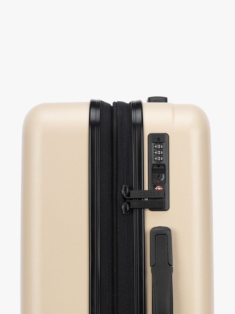 TSA Approved lock of the CALPAK Evry Carry-On Luggage in beige exterior and polka dot interior Polka Dot