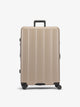 CALPAK Brown chocolate large luggage made from an ultra-durable polycarbonate shell and expandable by up to 2"; LCO1028-CHOCOLATE
