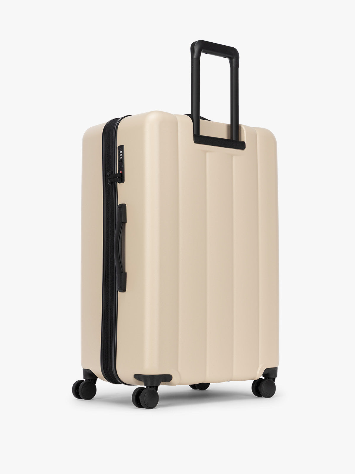 Backside of CALPAK Evry Large Luggage in beige exterior and interior polka dot in Polka Dot; LCO1028-POLKA-DOT