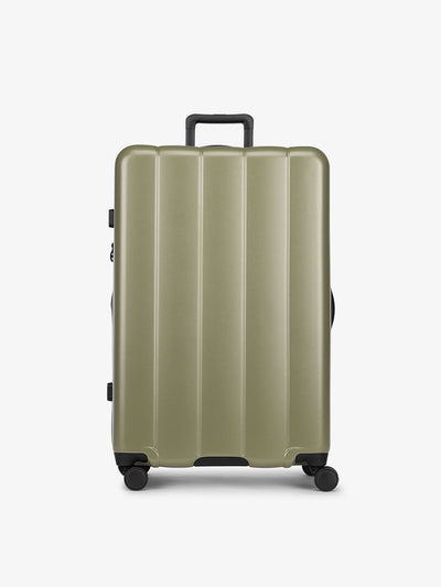 CALPAK Pistachio green large luggage made from an ultra-durable polycarbonate shell and expandable by up to 2; LCO1028-PISTACHIO view 1