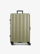 CALPAK Pistachio green large luggage made from an ultra-durable polycarbonate shell and expandable by up to 2"; LCO1028-PISTACHIO