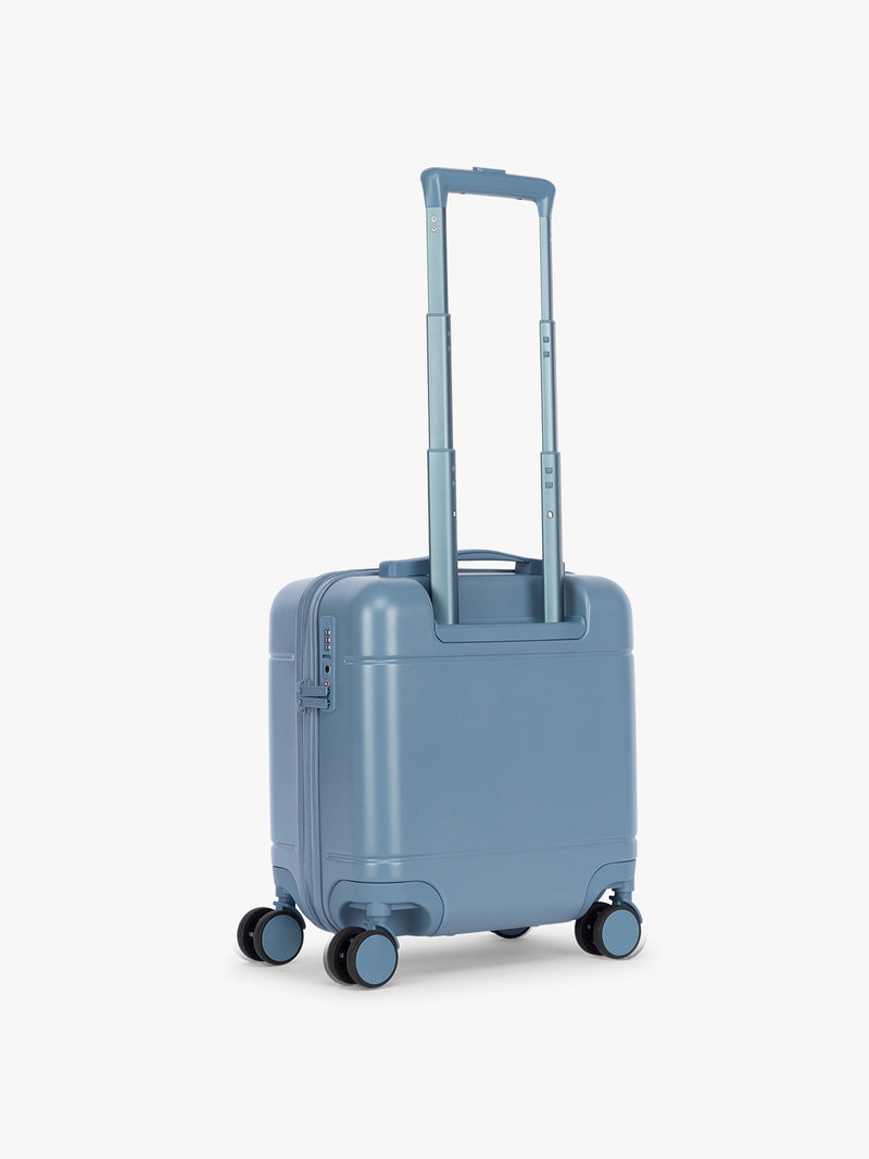 Back view of CALPAK Hue Mini Carry On in light blue French Blue with Gingham interior