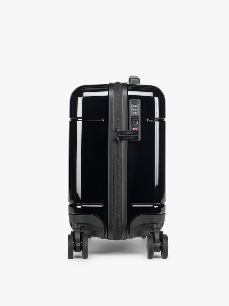 CALPAK Glazed Black Hue Mini Carry On suitcase with a black handle side view on a white background