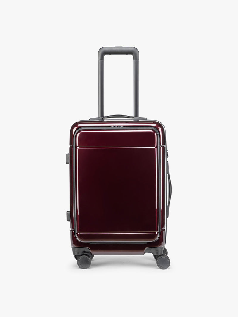 Front view of CALPAK Hue Front Pocket Carry On Luggage in maroon Glazed Dark Cherry