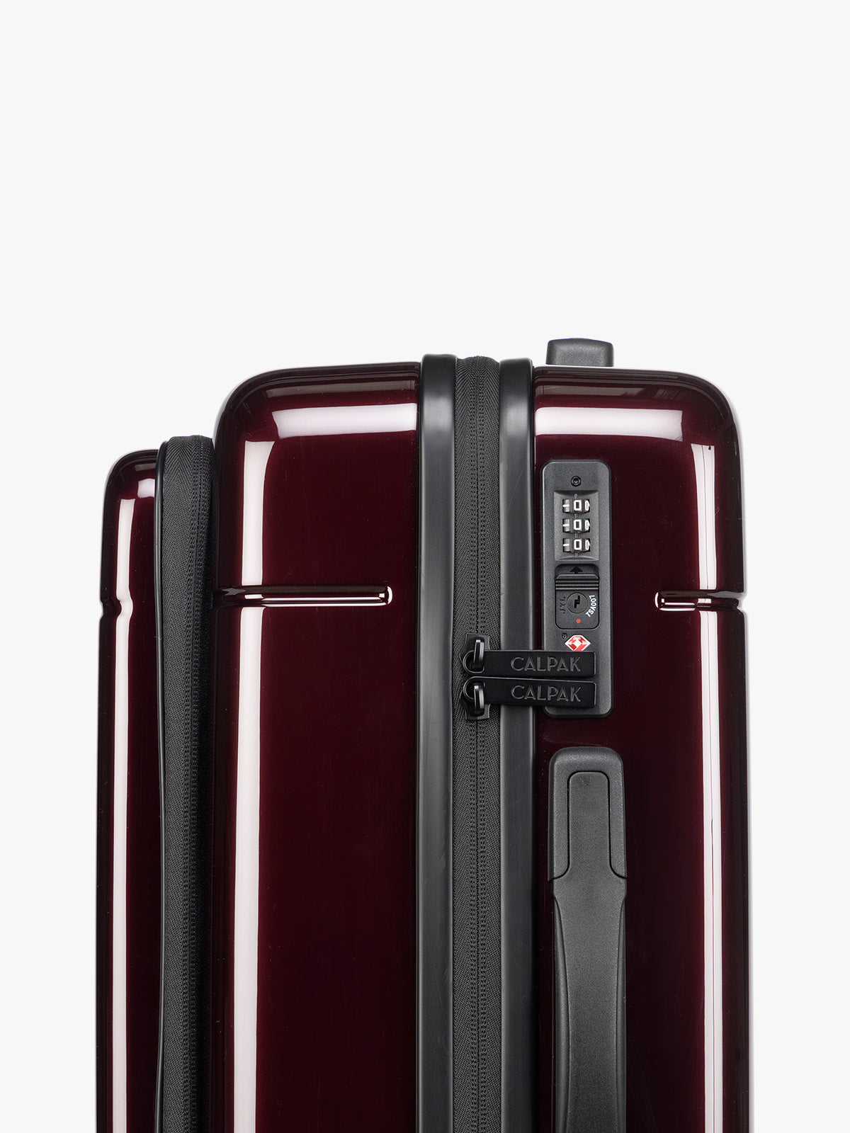 TSA approved lock on CALPAK Hue Front Pocket Carry On Luggage in maroon Glazed Dark Cherry ; LHU1020-GLAZED-DARK-CHERRY
