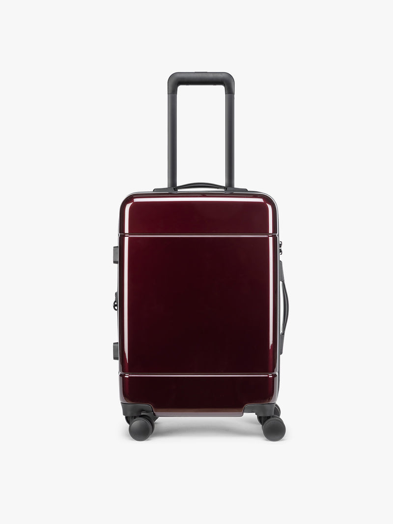 CALPAK Hue Carry On Luggage in Dark Cherry Red on white background