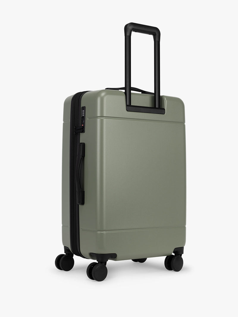 CALPAK Hue Medium Luggage back view in green Juniper