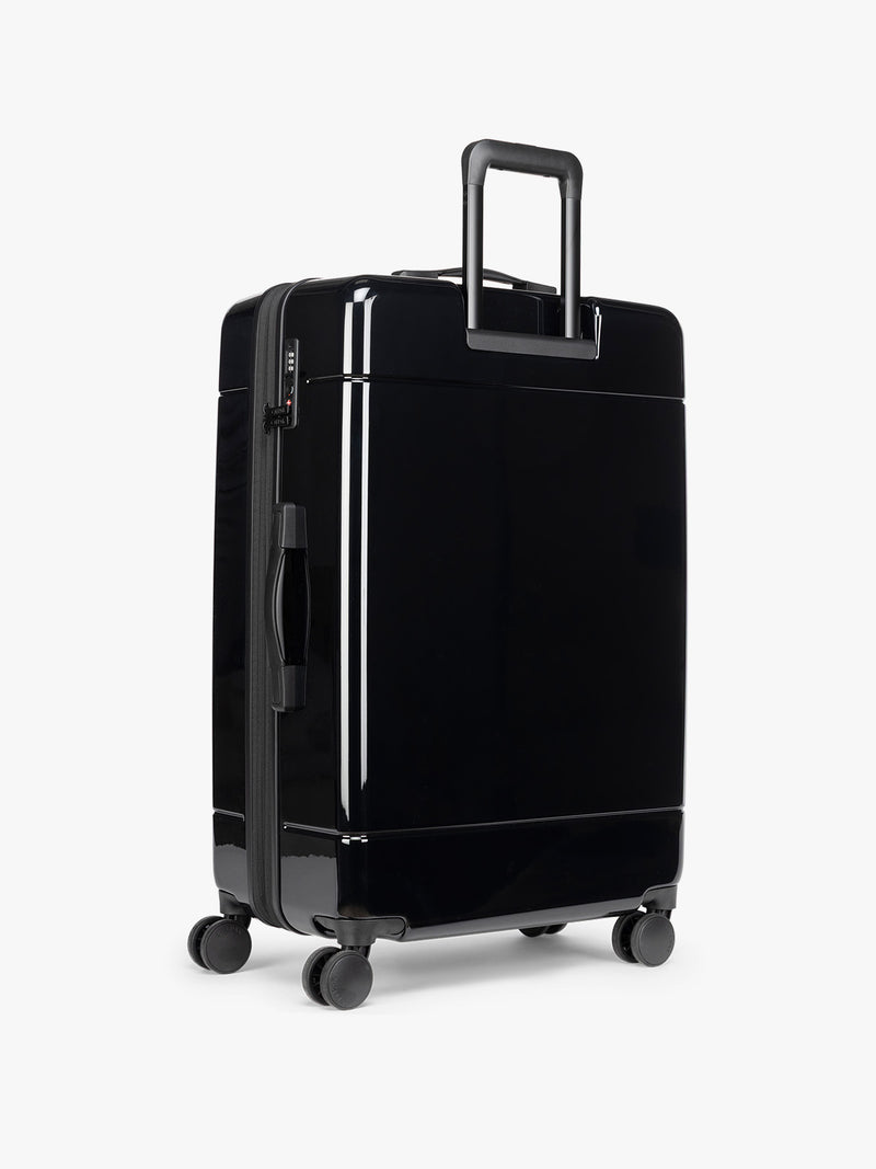 CALPAK black Hue Large Luggage in Glazed Black backside