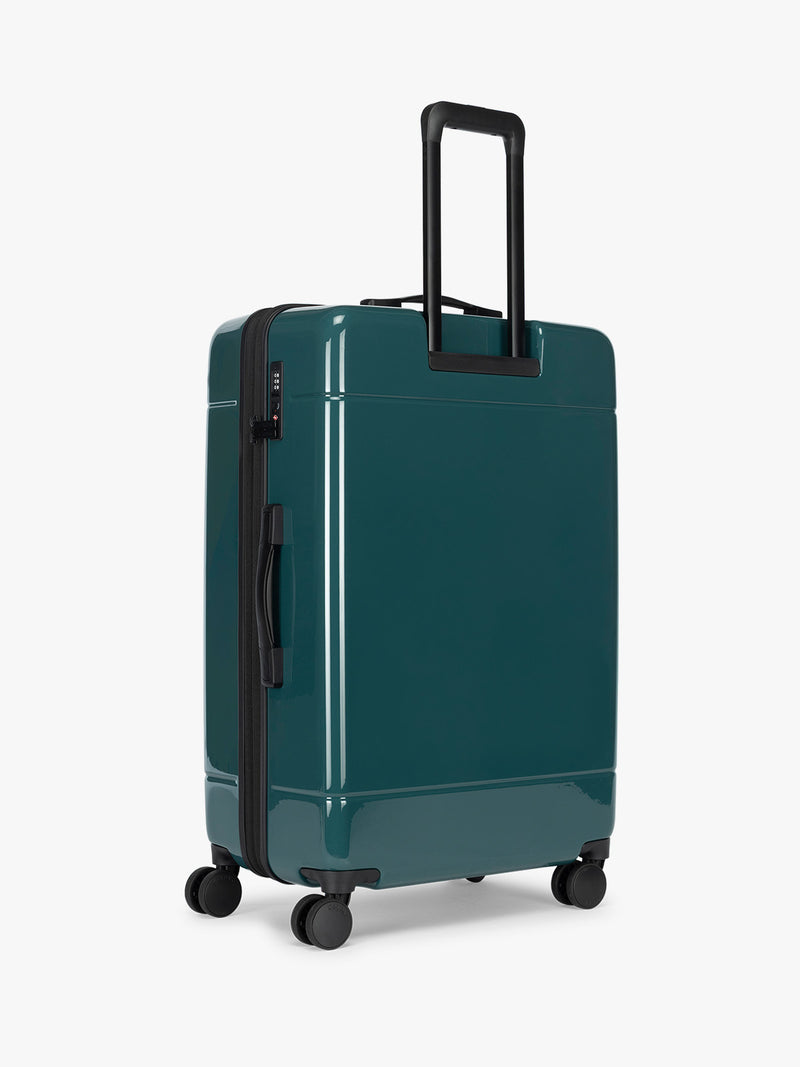 Back view of CALPAK Hue Large Luggage in dark green Kale