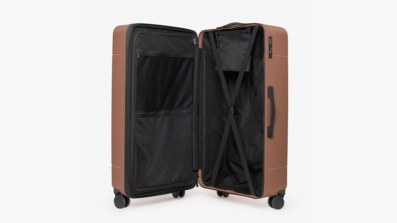 CALPAK Hue Large Trunk Luggage in brown opened to show capacity