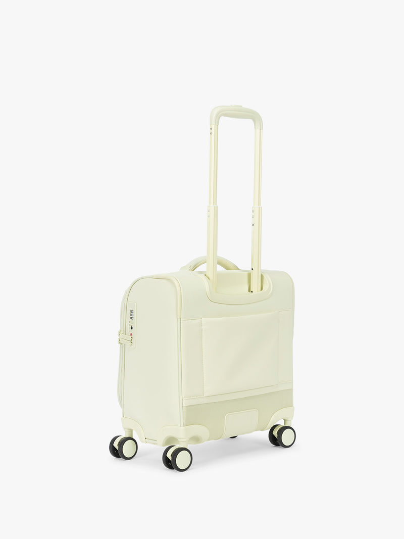 Backside of CALPAK Luka Soft-Sided Mini Carry On Luggage in light green Celadon with spinner wheels and handle