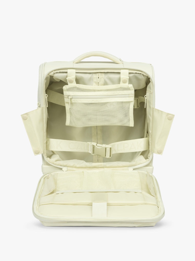 Interior with pockets and compartments of CALPAK Luka Soft-Sided Mini Carry On Luggage in light green Celadon with spinner wheels and handle