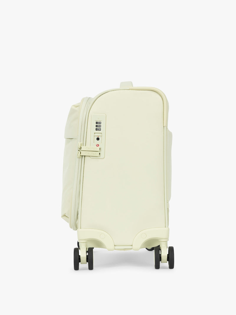 Side view with TSA approved lock of the CALPAK Luka Soft-Sided Mini Carry On Luggage in light green Celadon with spinner wheels and handle