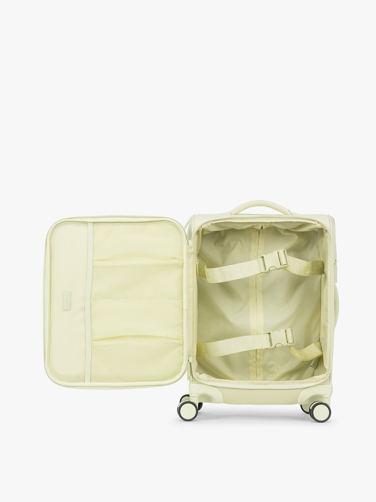 Opened showing interior of the CALPAK Luka Soft-Sided Carry On Luggage in light green Celadon on a white background with handle and spinner wheels; LSM1020-CELADON