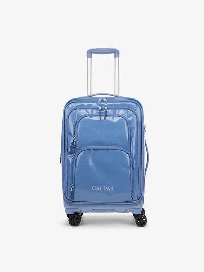 Studio product shot of front-facing CALPAK Terra Carry-On luggage with soft shell and 360 spinner wheels in glacier blue; model LTE1020-GLACIER