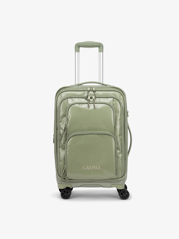 Studio product shot of front-facing CALPAK Terra Carry-On luggage with soft shell and 360 spinner wheels in juniper