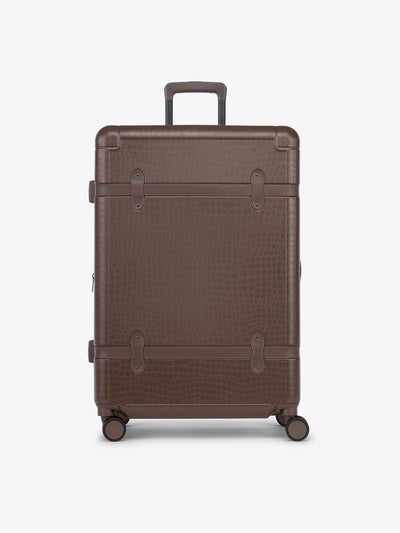 CALPAK TRNK large suitcase with hard shell exterior and four 360 spinner wheels in espresso vintage trunk style; LTK1028-ESPRESSO view 1
