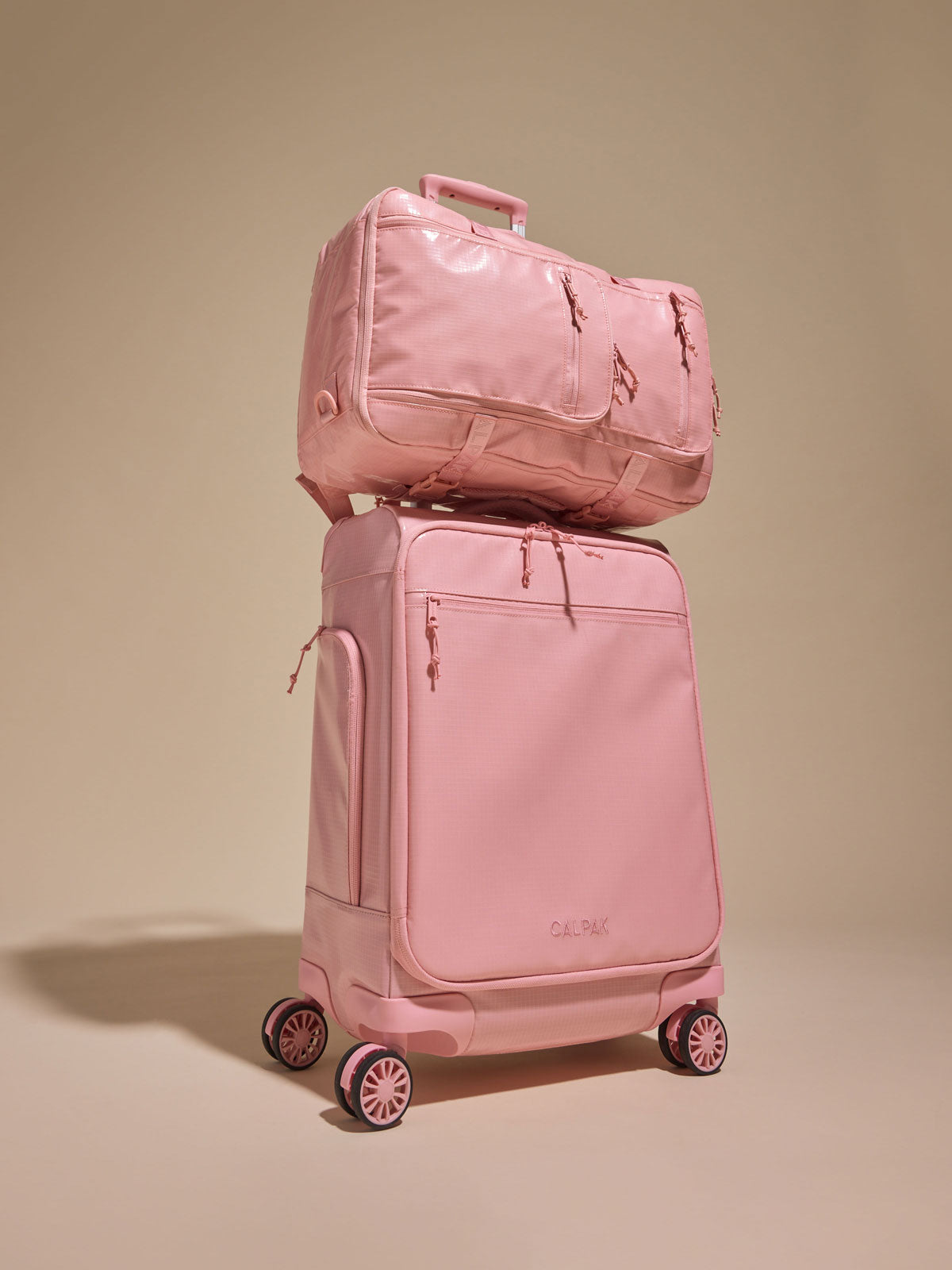 CALPAK Terra 35L Soft Sided Carry On in pink blossom with  the Terra Backpack ; LTR1020-BLOSSOM