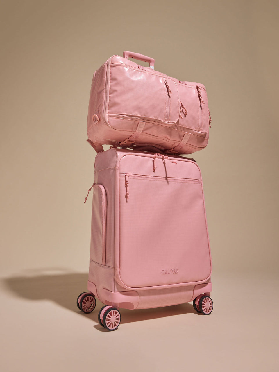 CALPAK Terra 35L Soft Sided Carry On in pink blossom with  the Terra Backpack ; LTR1020-BLOSSOM