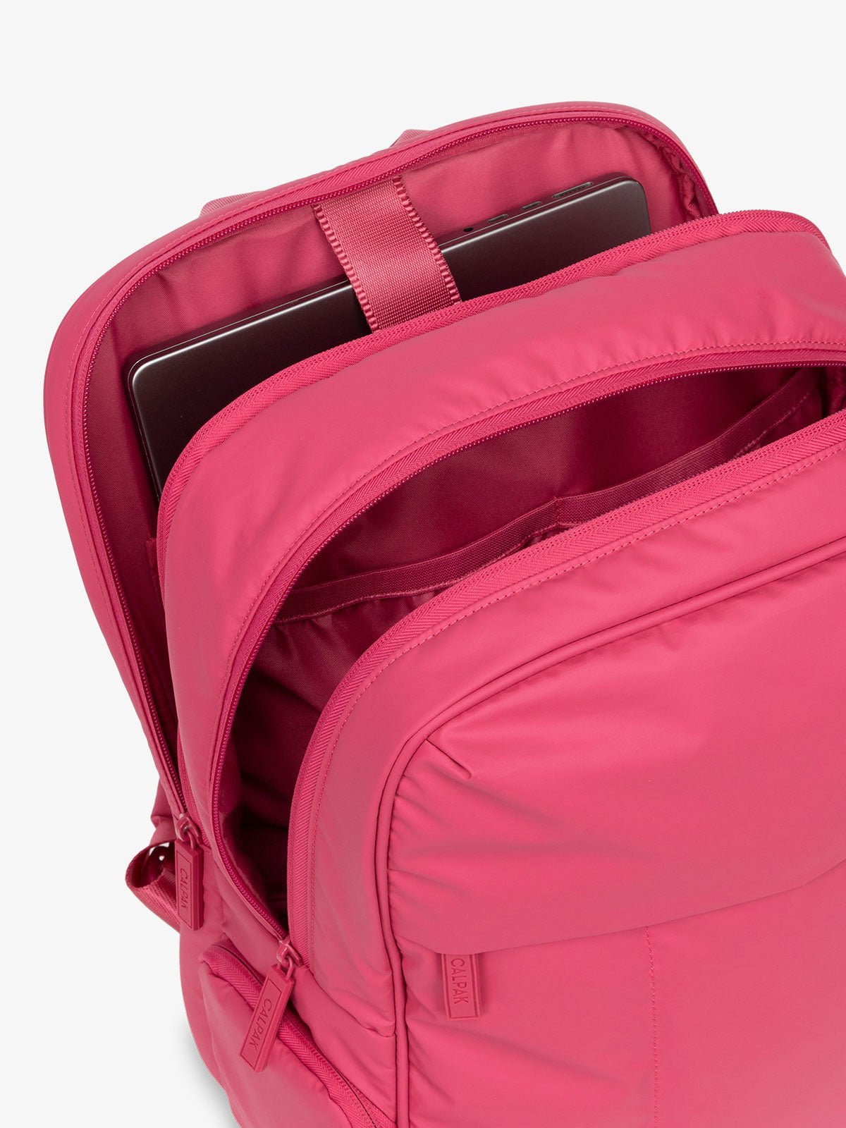 CALPAK Luka 15 Inch Laptop Backpack with soft puffy exterior and multiple pockets in pink
