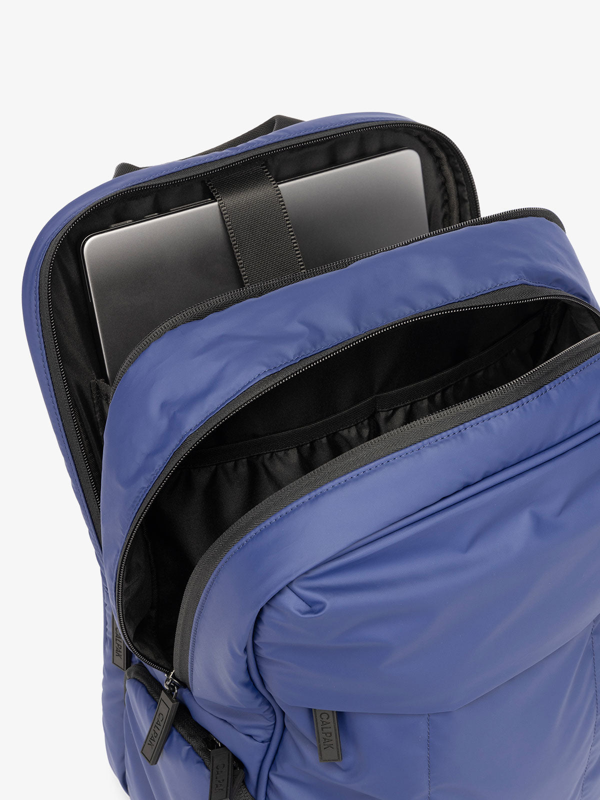 CALPAK Luka 15 Inch Laptop Backpack with soft puffy exterior and multiple pockets in navy; BPL2001-NAVY