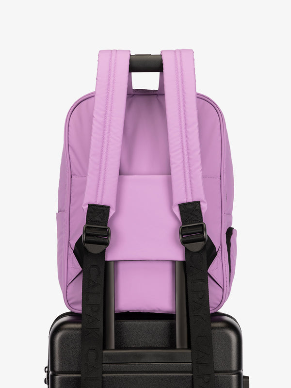 CALPAK water resistant Luka Laptop Backpack with adjustable shoulder straps and trolley sleeve in lilac purple