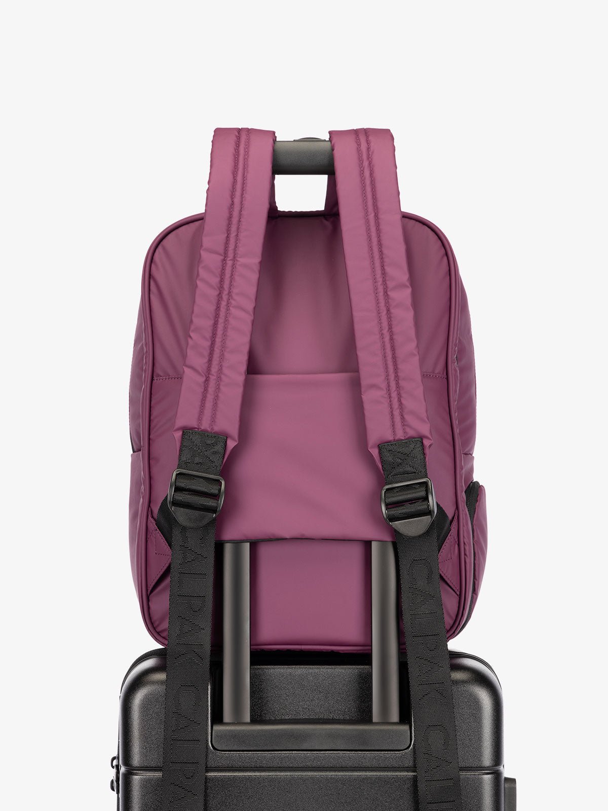 CALPAK water resistant Luka Laptop Backpack with adjustable shoulder straps and trolley sleeve in purple plum