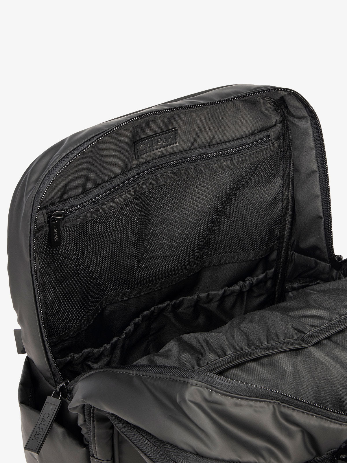 Close up of main compartment of CALPAK laptop backpack with multiple interior pockets in black; BPX2301-MATTE-BLACK