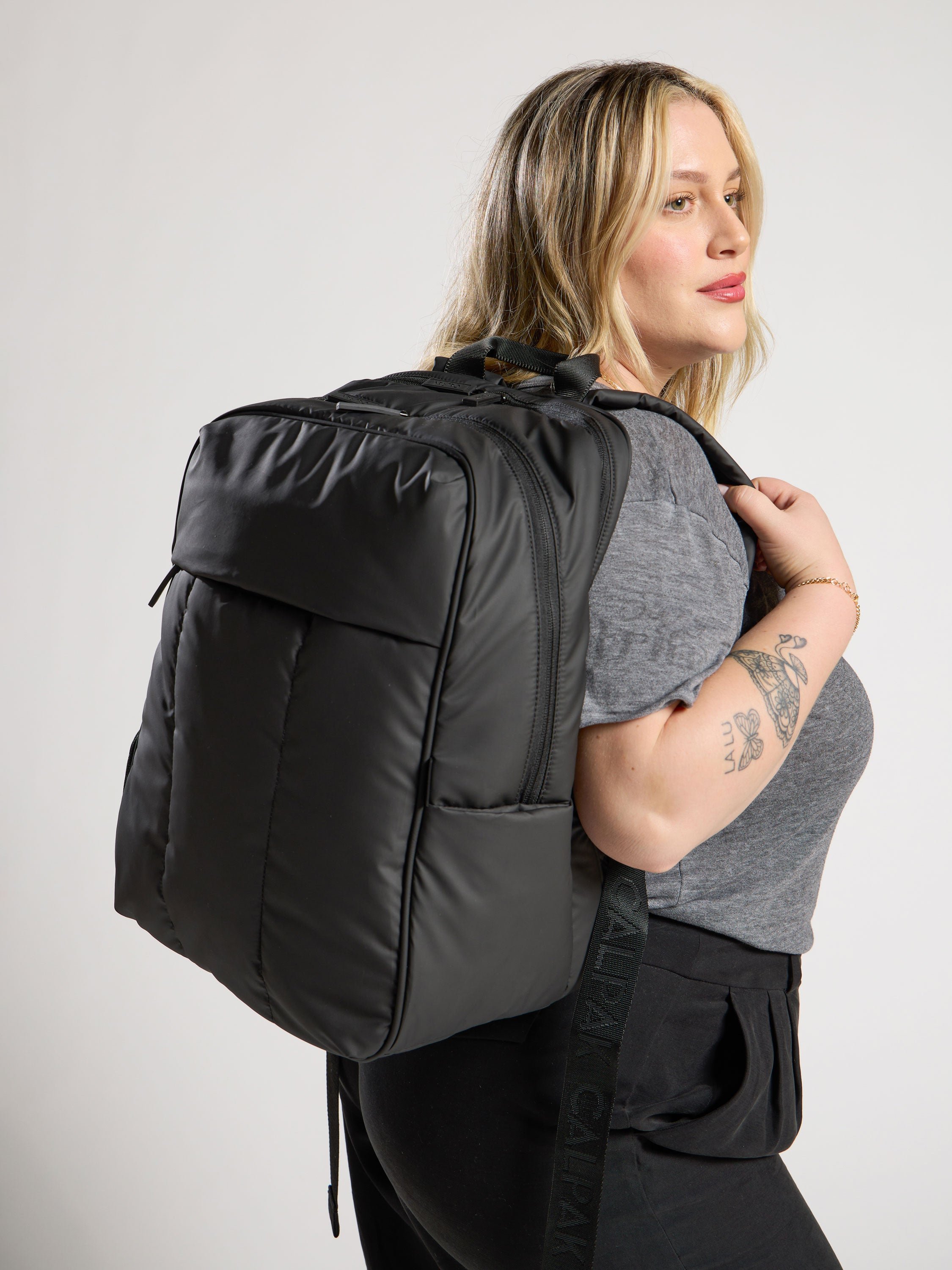 Model wearing luka laptop backpack for 17 inch laptop in black