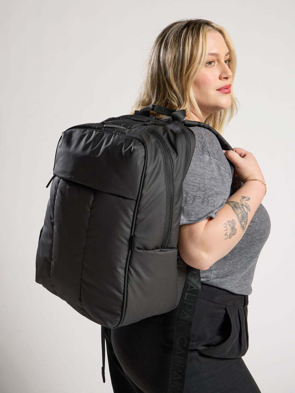 Model wearing luka laptop backpack for 17 inch laptop in black; BPX2301-MATTE-BLACK