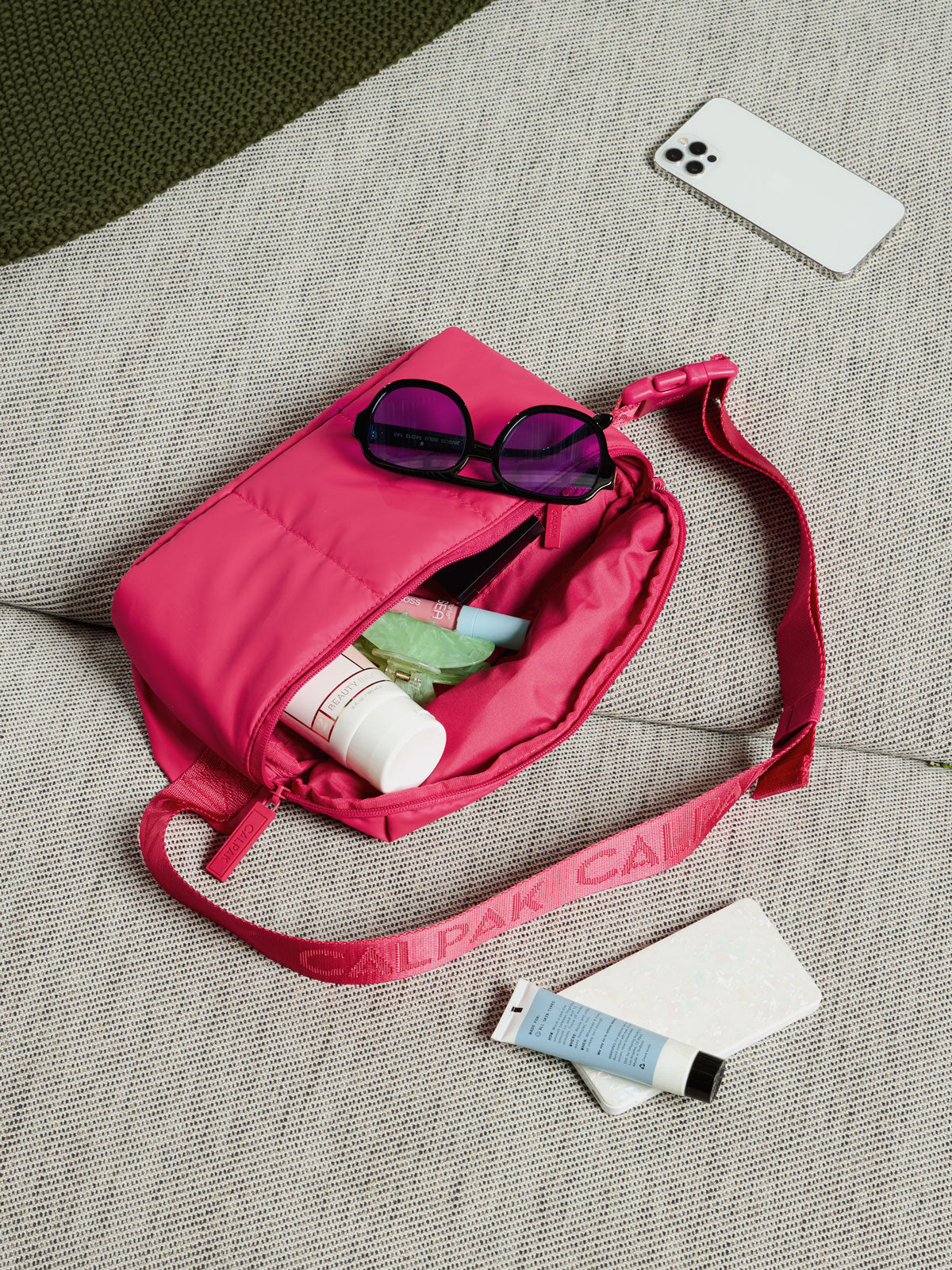 Items within CALPAK Luka Belt Bag in dragonfruit; BB1901-DRAGONFRUIT