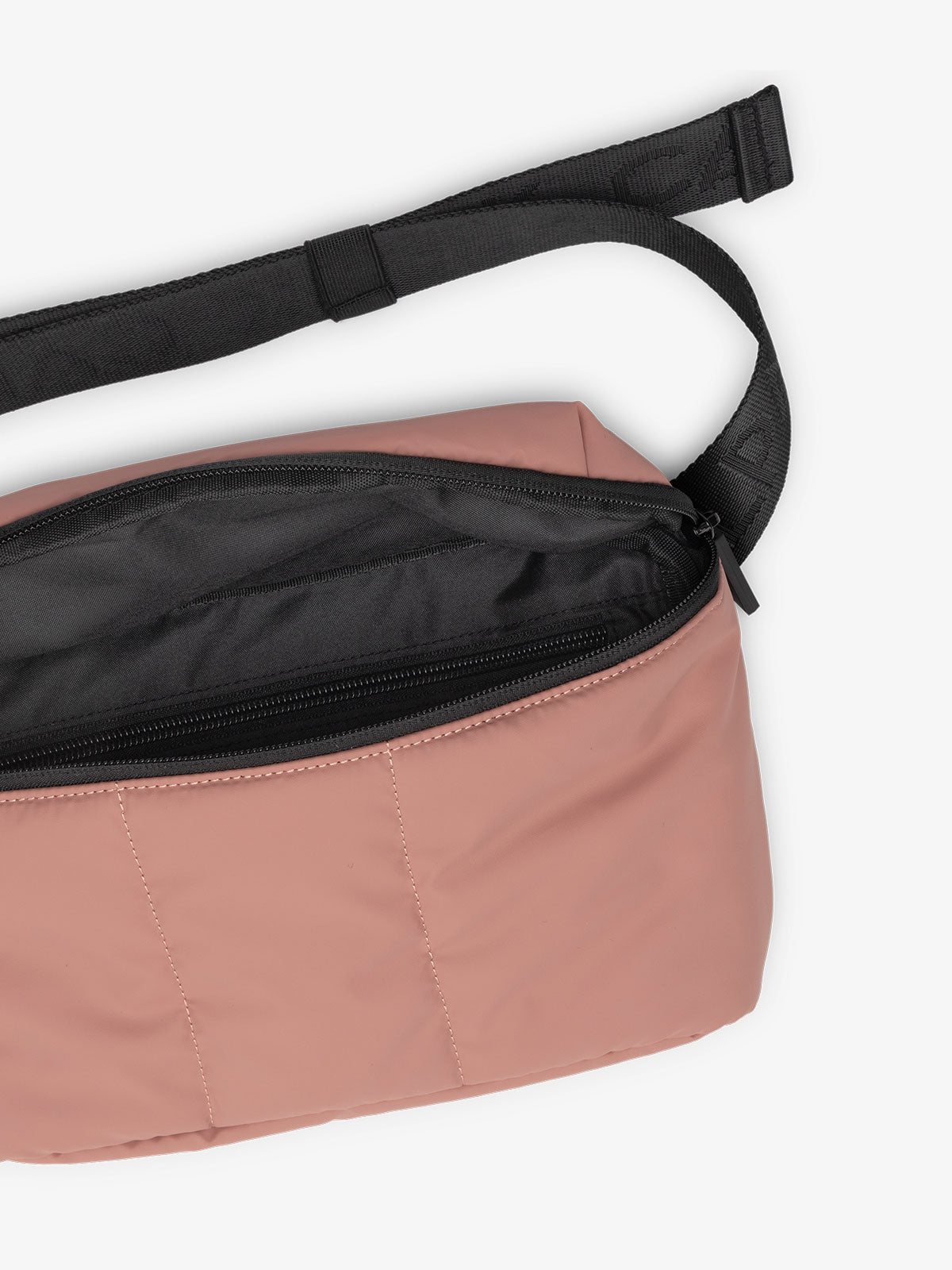 CALPAK Luka Belt Bag close up interior and strap in peony pink; BB1901-PEONY