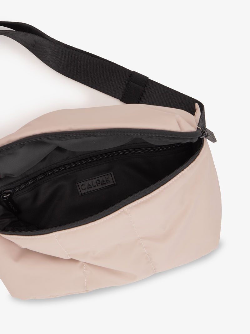 Luka belt bag with adjustable crossbody strap and interior pocket in light pink