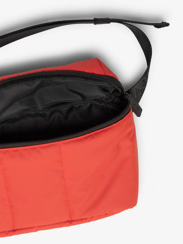CALPAK Luka Belt Bag close up interior and strap in red rouge