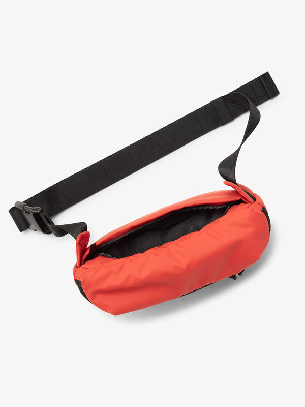 CALPAK Luka Belt Bag with adjustable strap and hidden back pocket in red