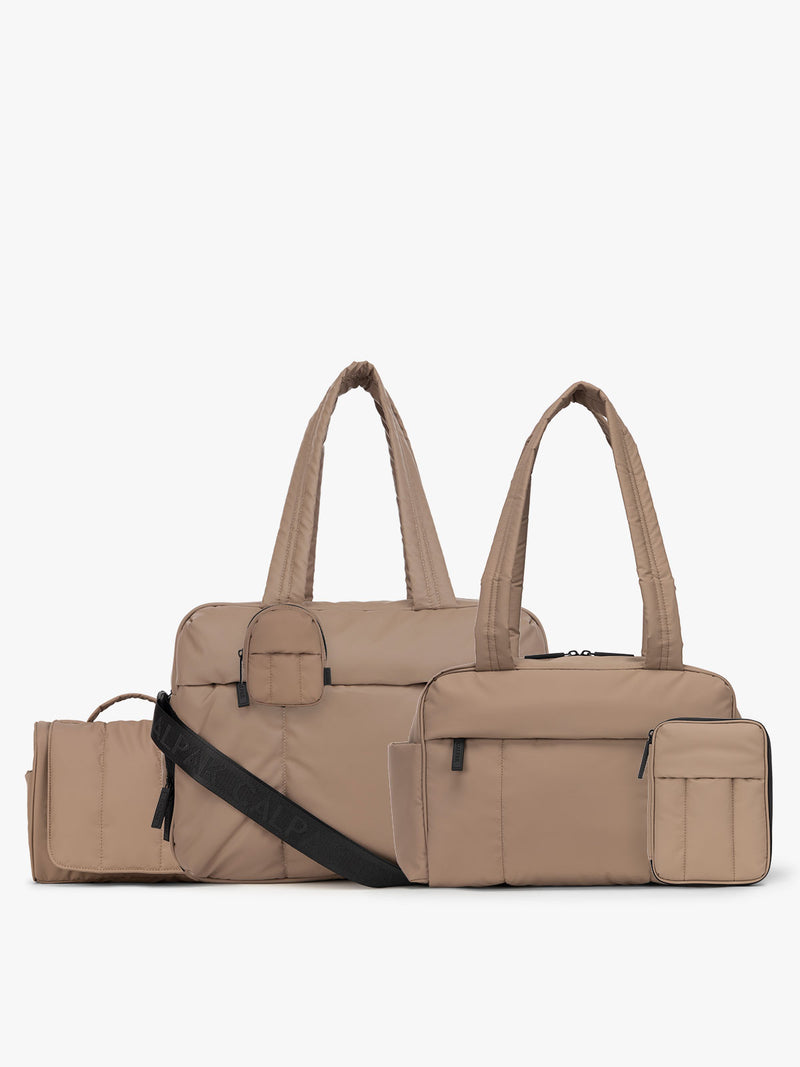 CALPAK Luka Bundle in brown chocolate. Bundle include Luka Duffel, Luka Mini Duffel, Luka Hanging Toiletry Bag, Luka Zippered Passport Wallet and Luka Backpack Key Pouch