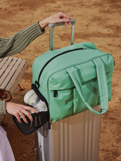 CALPAK Luka Duffel puffy Bag with detachable strap and zippered front pocket in sage green; DSM1901-SAGE view 2