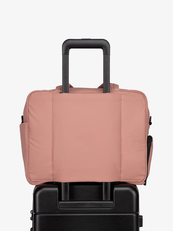 CALPAK Luka Duffel bag with luggage trolley sleeve in peony