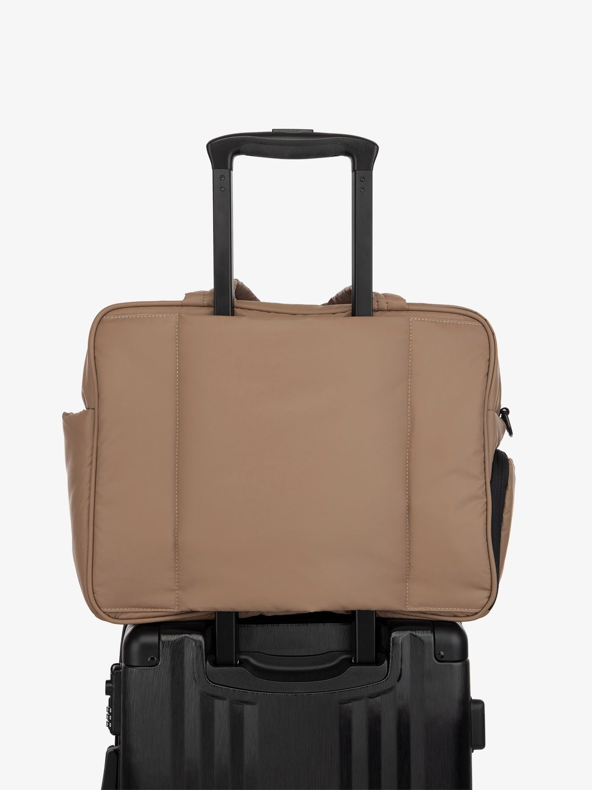 brown CALPAK Luka duffle bag with luggage trolley sleeve
