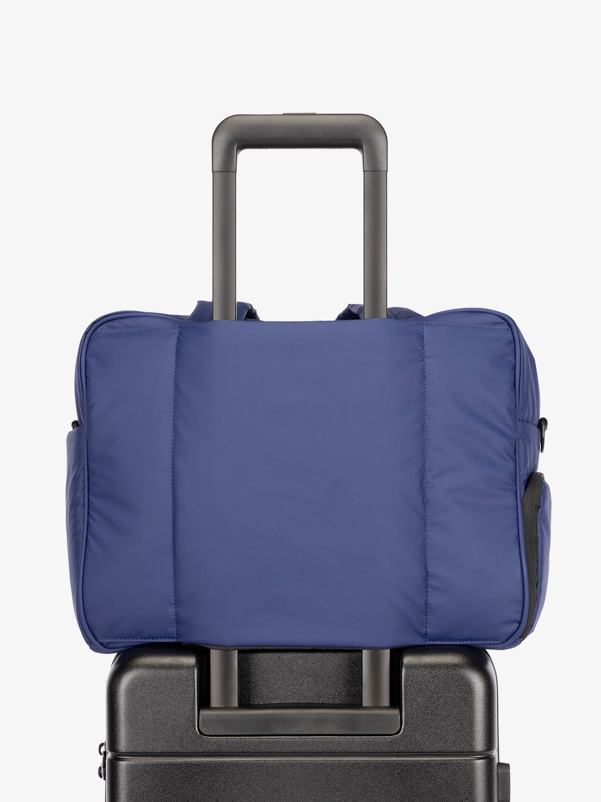 CALPAK Luka Duffel bag with luggage trolley sleeve in navy